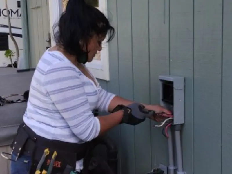 Licensed electrician wiring an exterior subpanel in Camas