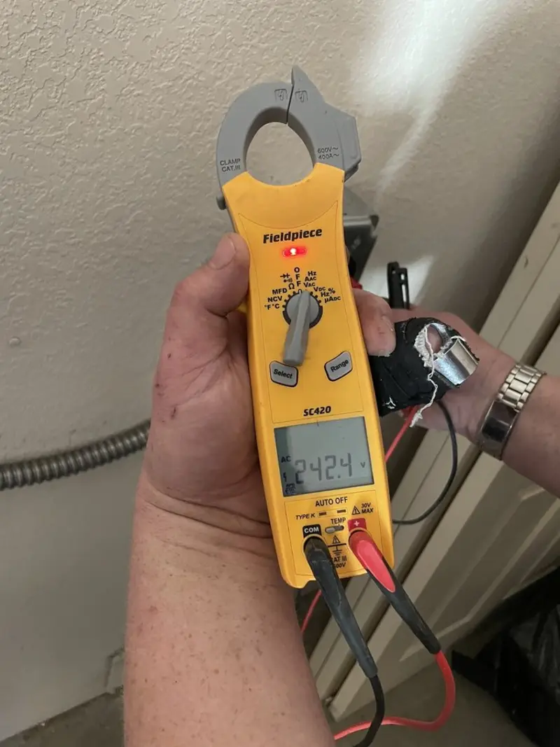 Voltage testing with clamp meter during Electrical Installation Services in Camas